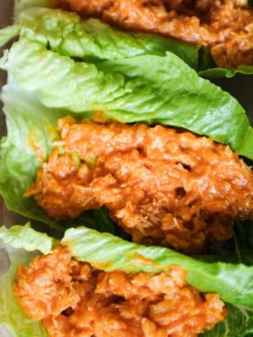 close up of buffalo chicken salad in lettuce wraps.