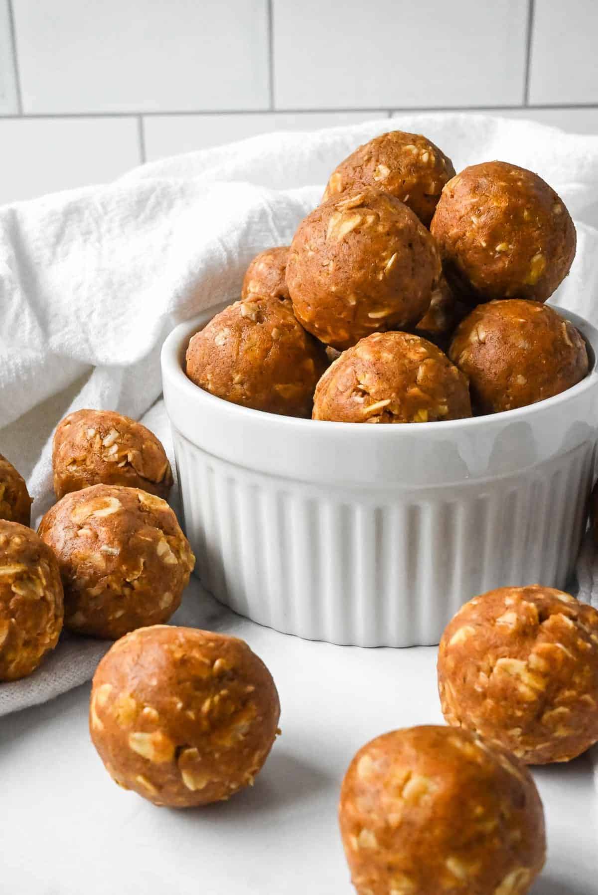bowl of pumpkin protein balls in white bowl.