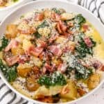 close up of instant pot chunky potato soup in a white bowl.