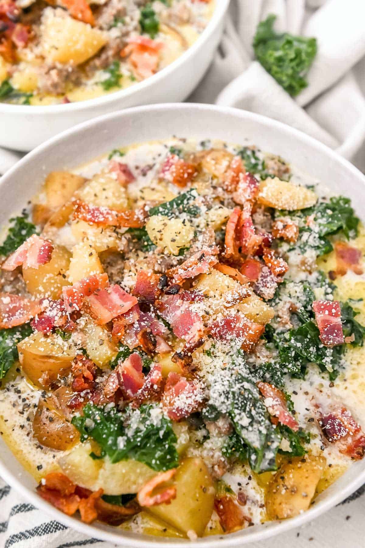 close up of instant pot chunky potato soup in a white bowl.
