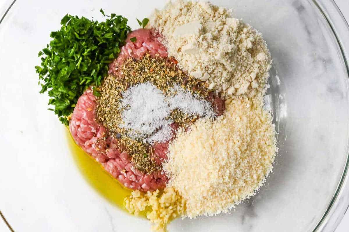turkey meatball ingredients in a glass bowl.