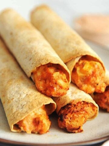 air fryer chicken taquitos on a plate.