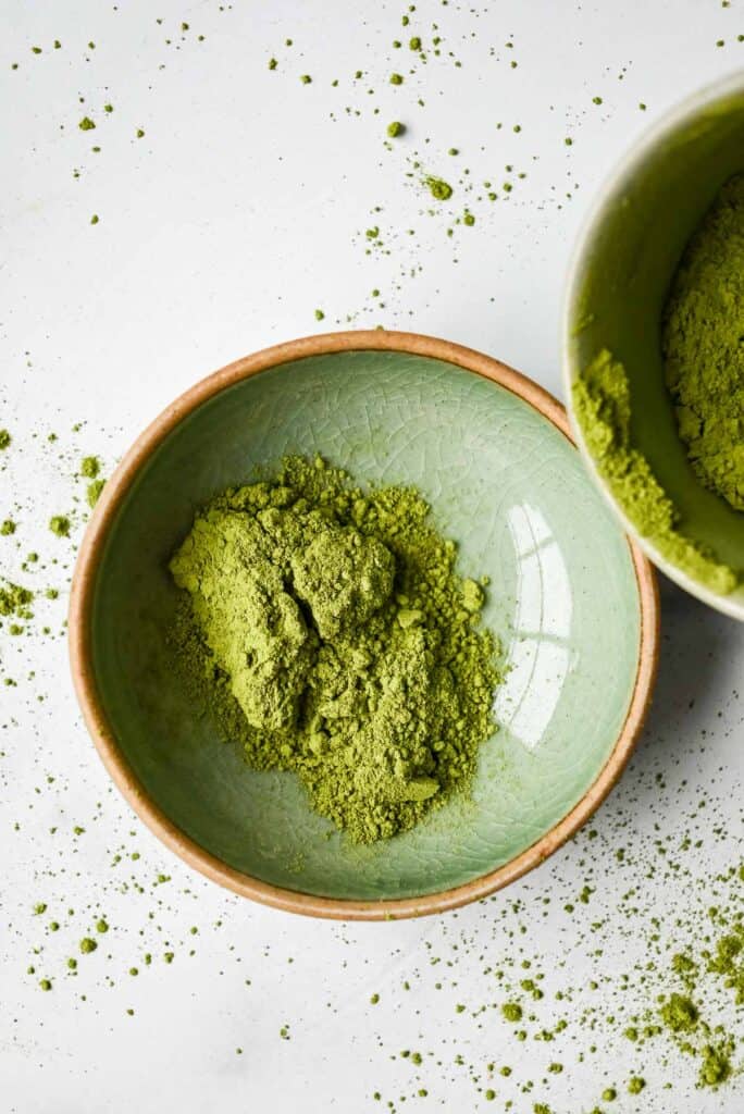 green matcha latte powder in a green dish