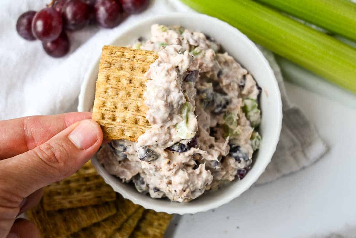 tuna salad in a bowl with crackers for serving