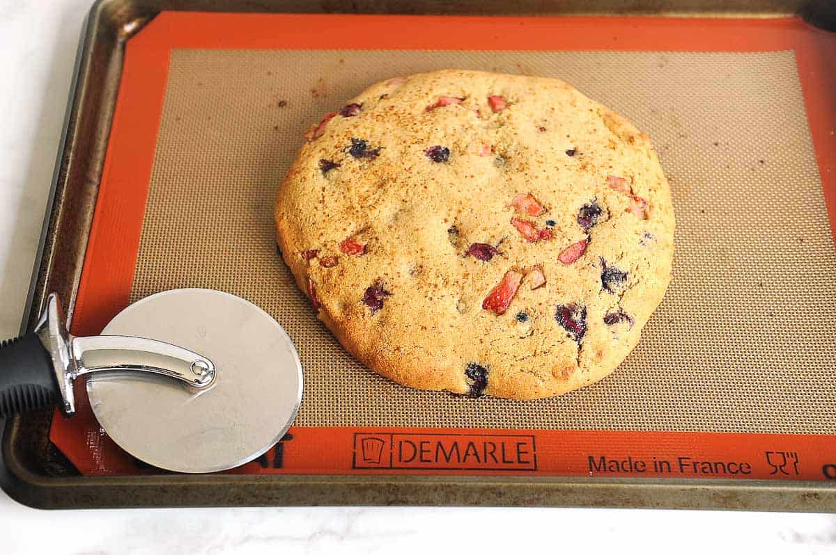 baked scones on a silpat before cutting