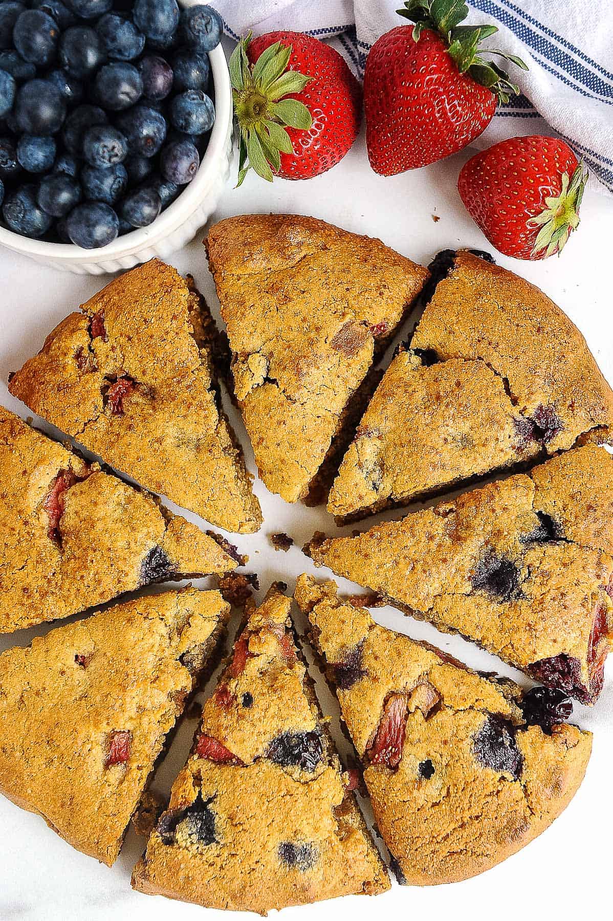 cut berry scones on a white plate