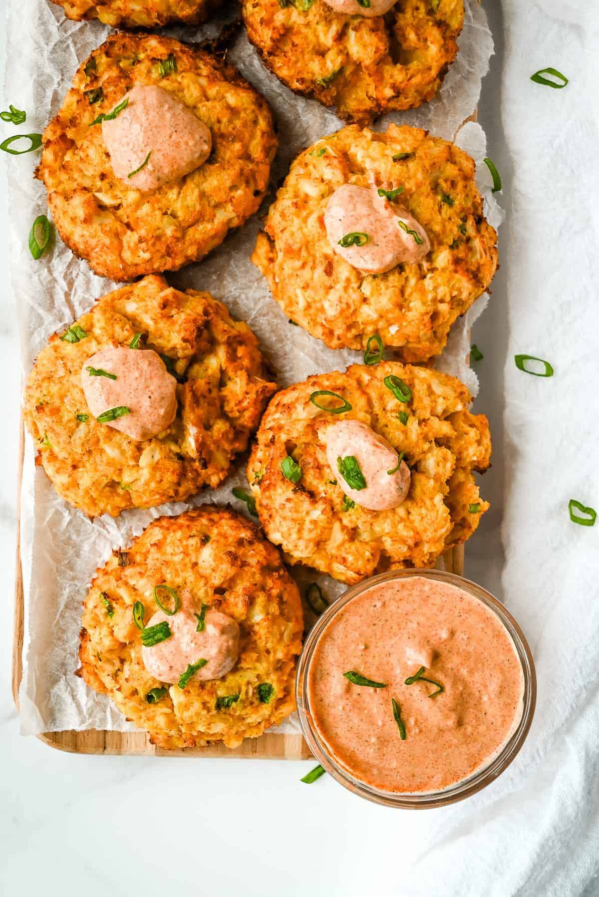 tray of air fried crab cakes with remoulade sauce.