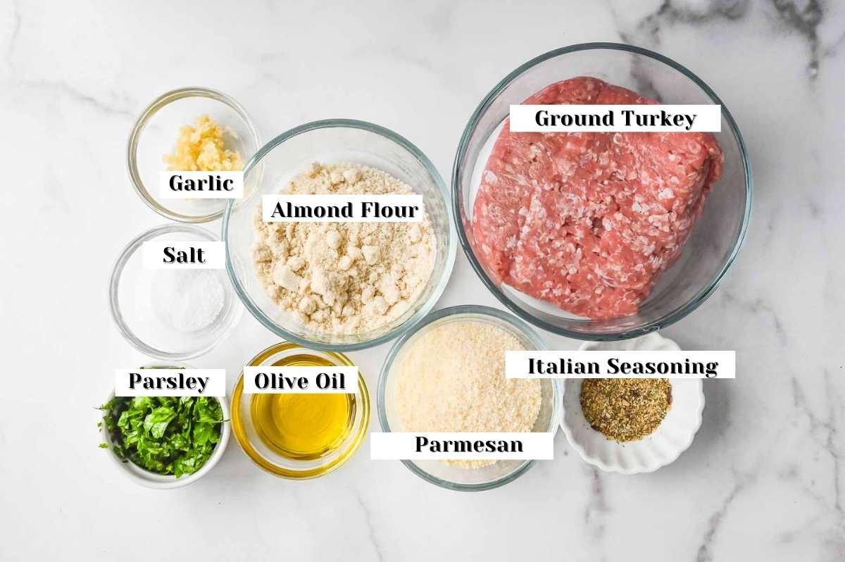 ingredients for this recipe labeled for ground turkey, italian seasoning, parmesan, almond flour, olive oil, parsley, salt and garlic.