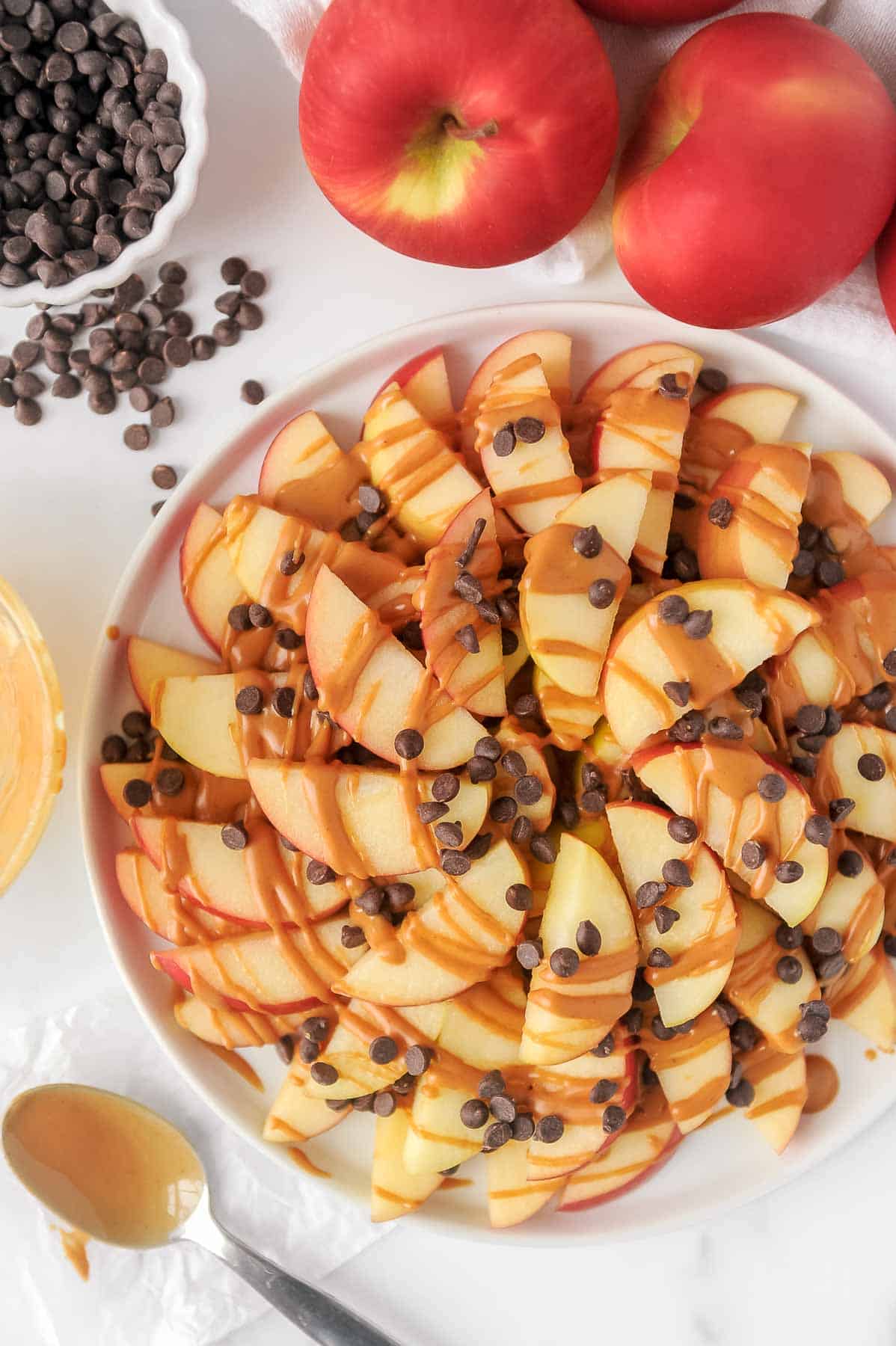 plate and ingredients to make healthy apple nachos