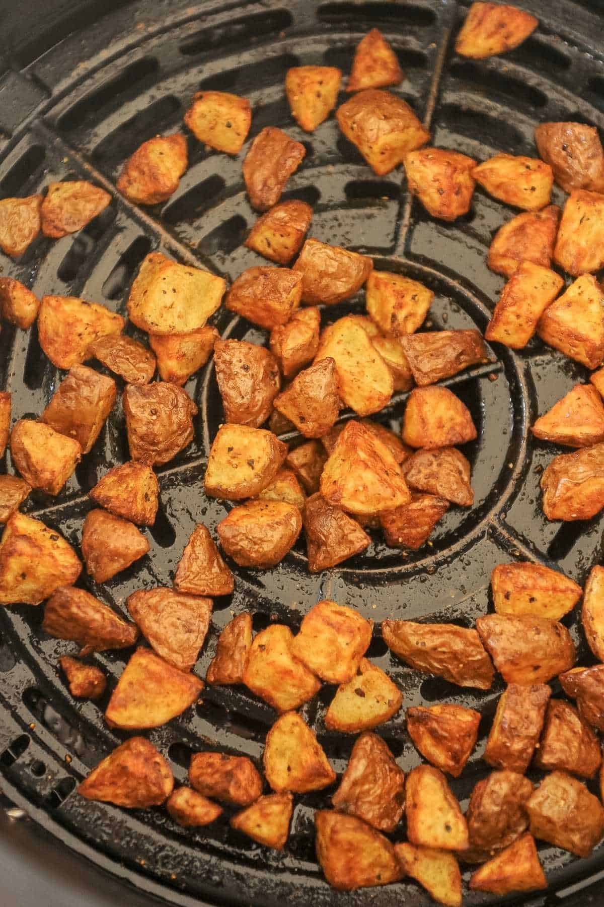 diced breakfast potatoes in air fryer basket
