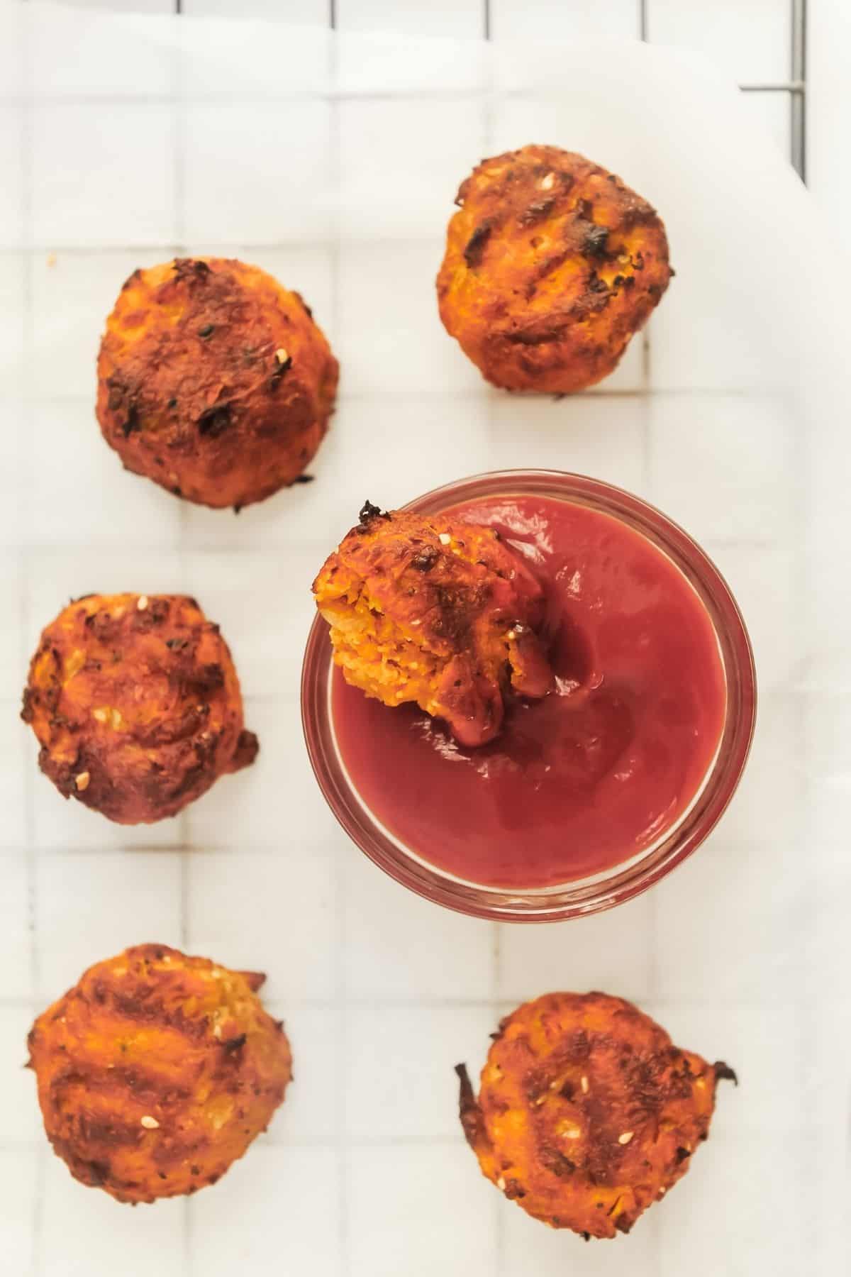 air fried hash browns dipped in ketchup