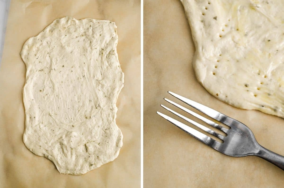 stretched pizza dough on a piece of parchment paper