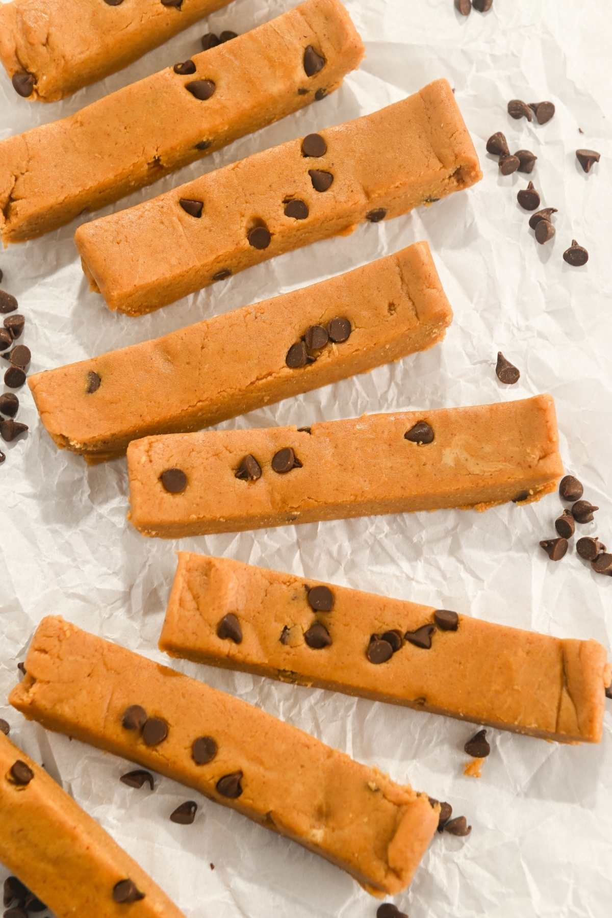 cut copycat perfect bars with mini chocolate chips on a white background.