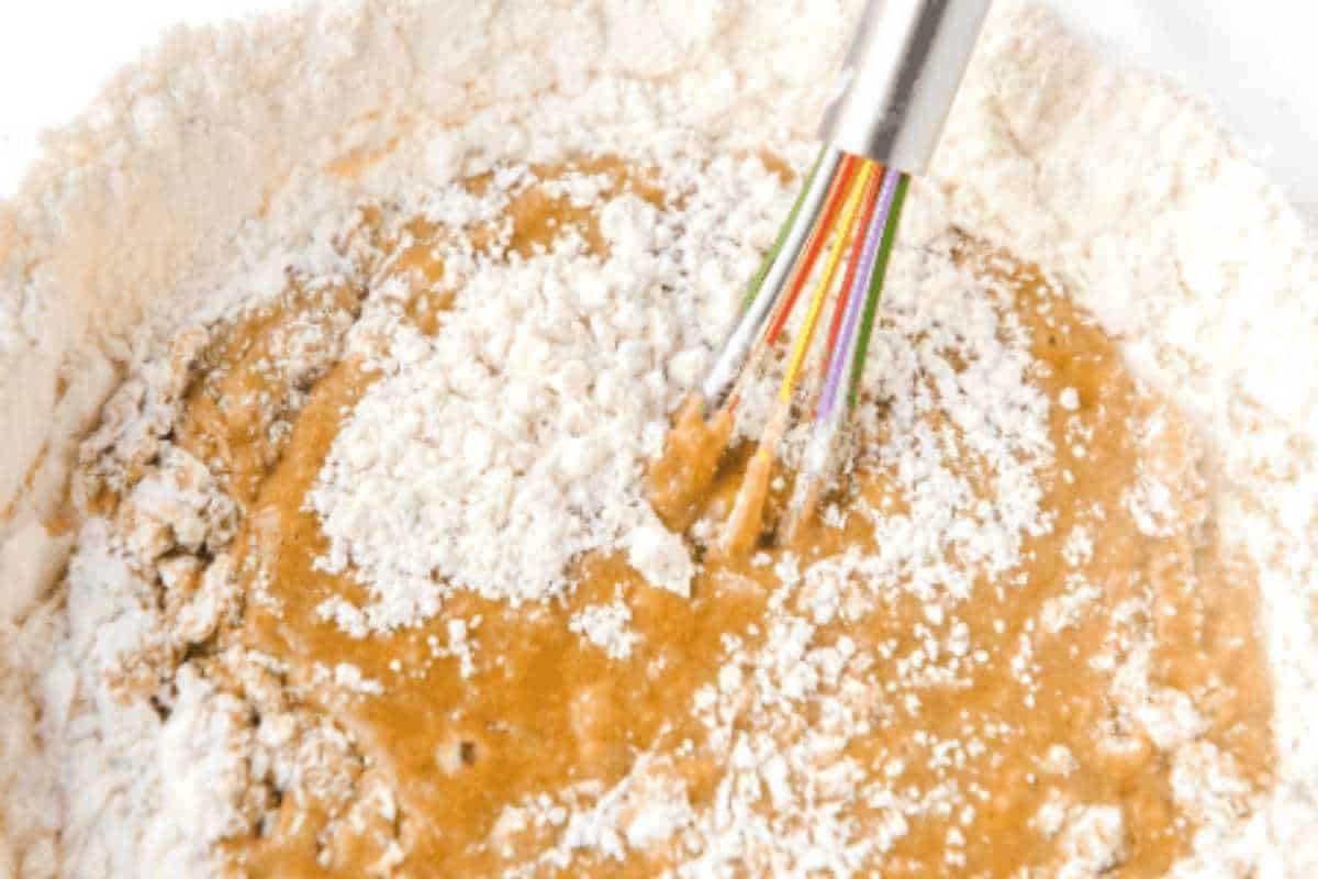 wet ingredients stirring into dry ingredients.