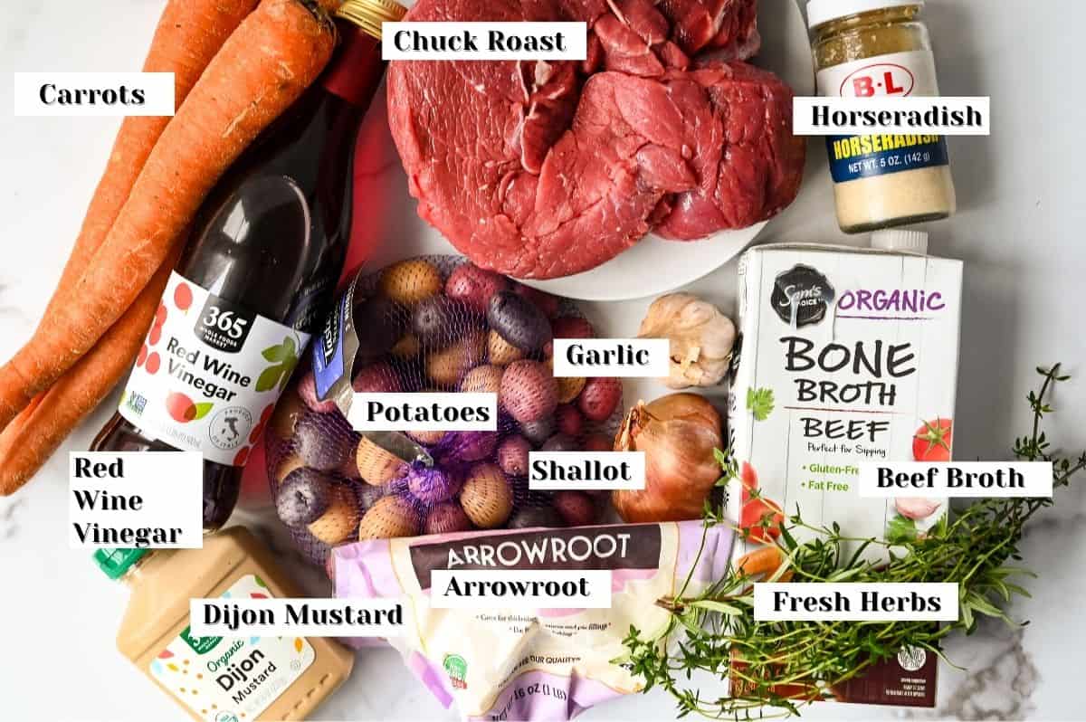 labeled ingredients for crock pot roast with potatoes and carrots.