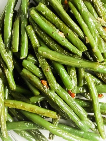 close up shot of blistered green beans.
