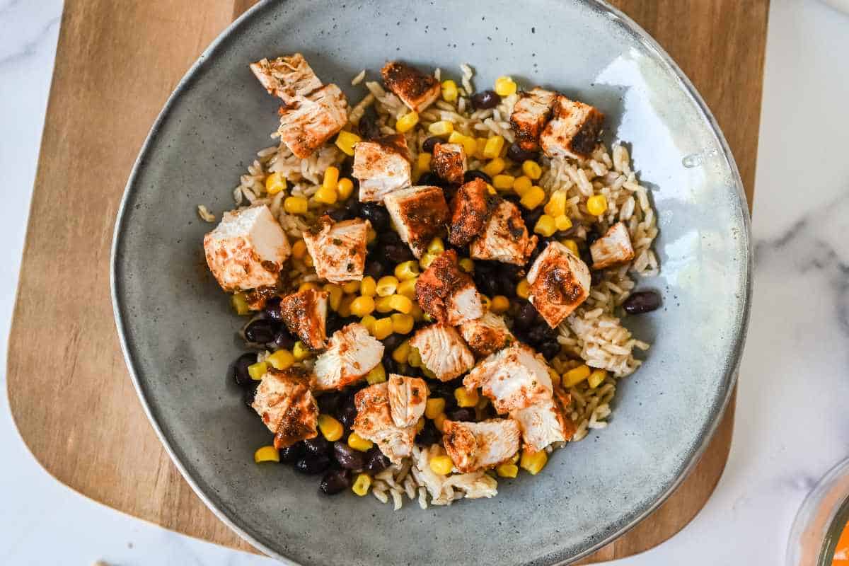 close up of southwest chicken bowl with rice, corn, beans, and chicken.