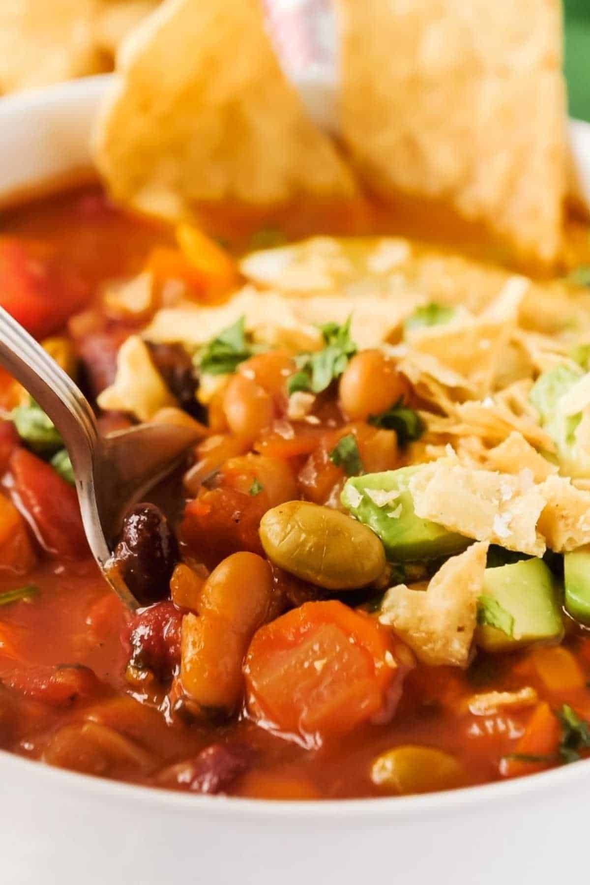 close up of bowl of ninja foodi chili with a spoon.