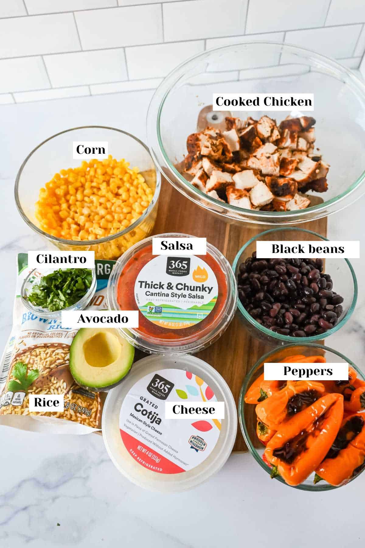 ingredients for this southwest chicken bowl recipe on a white background.