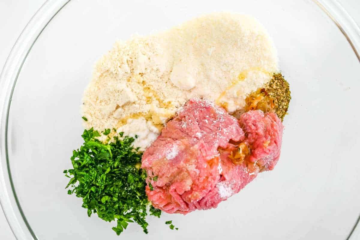 meatball ingredients in a glass bowl.