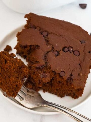 chocolate baked oatmeal on a plate with a fork.