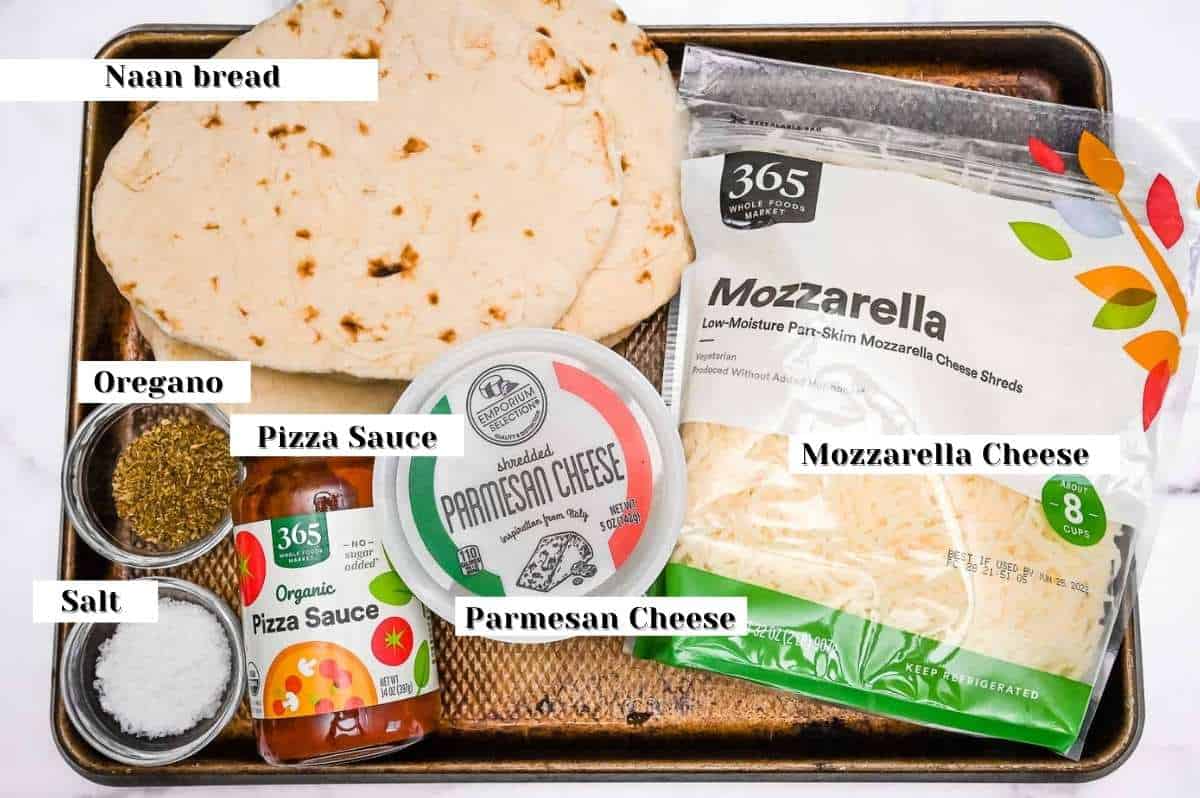 labeled ingredients for making air fryer naan pizza.