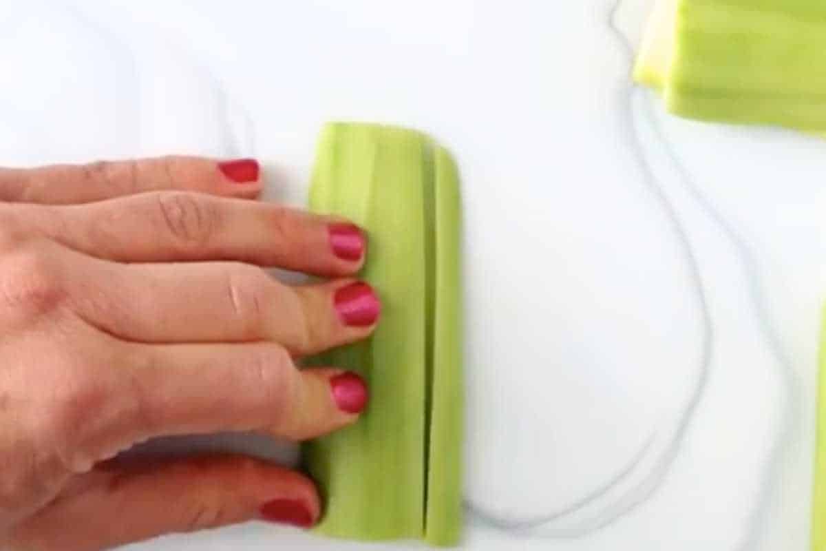 hand cutting zucchini into fries.