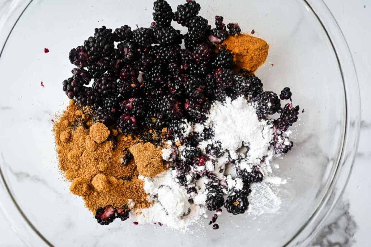 blackberry filling ingredients in a glass bowl.