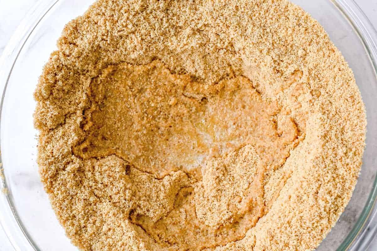 almond flour and butter in a glass bowl.
