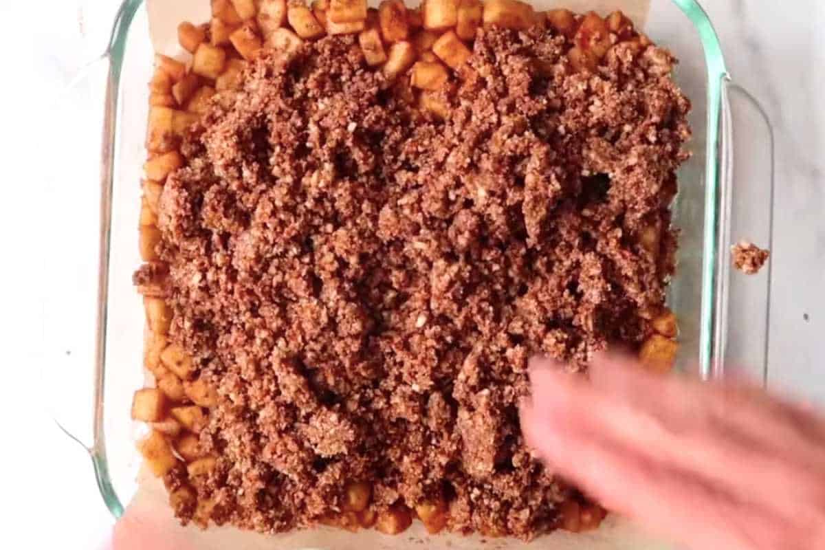 crumble ingredients in a square glass dish.