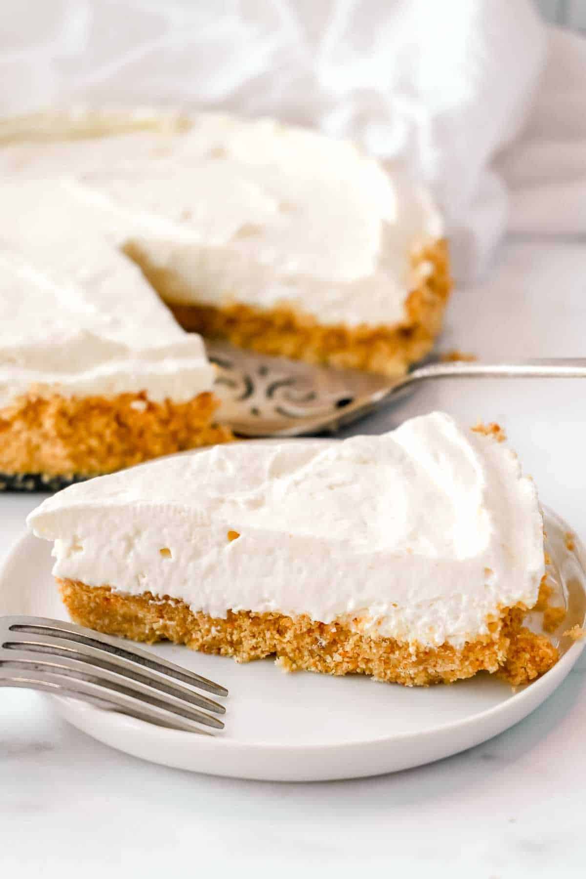 slice of no bake keto cheesecake on a white plate.