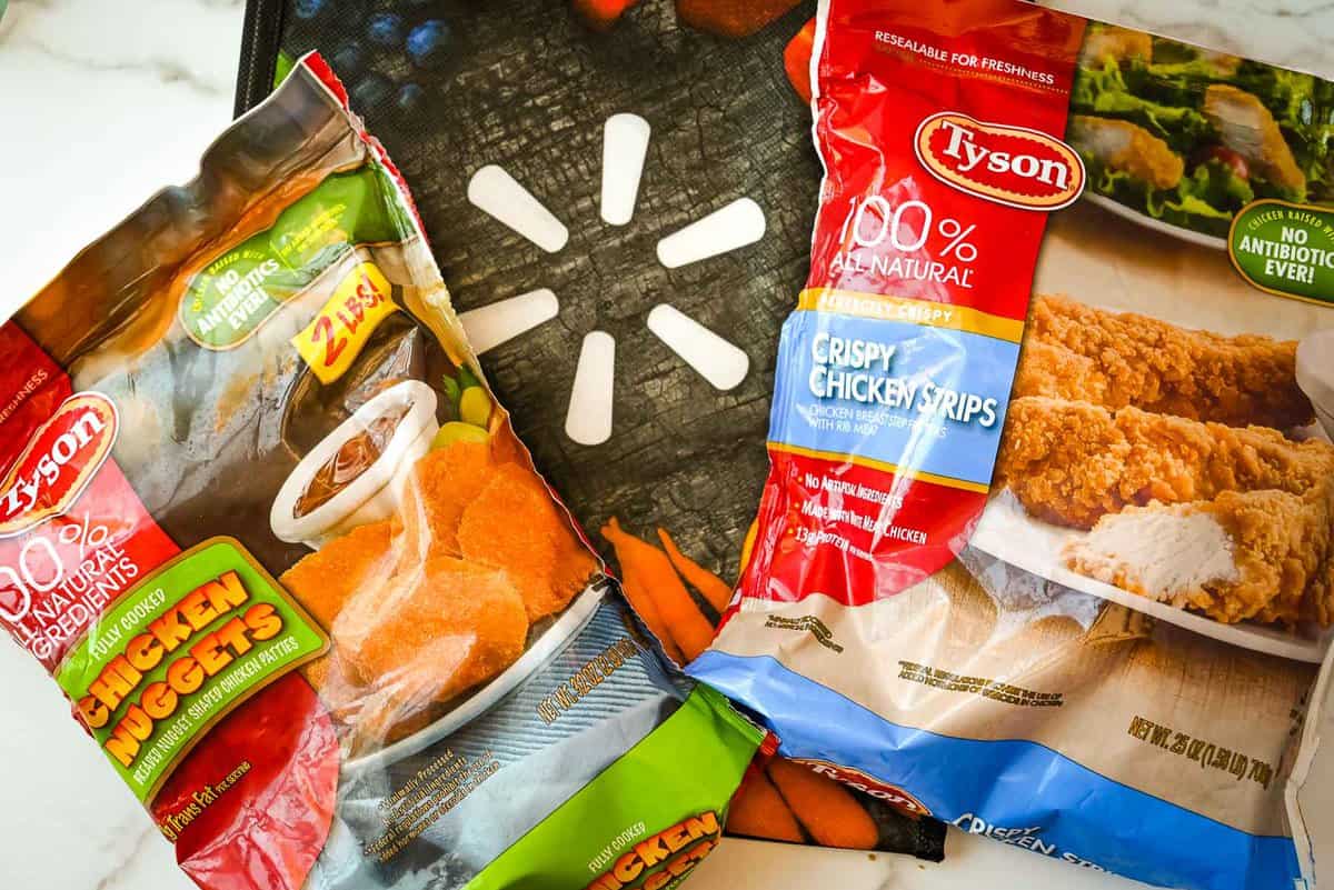 tyson chicken nuggets and strips on top of walmart bag.