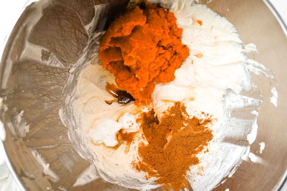 low-carb pumpkin cheesecake filling in a silver bowl.
