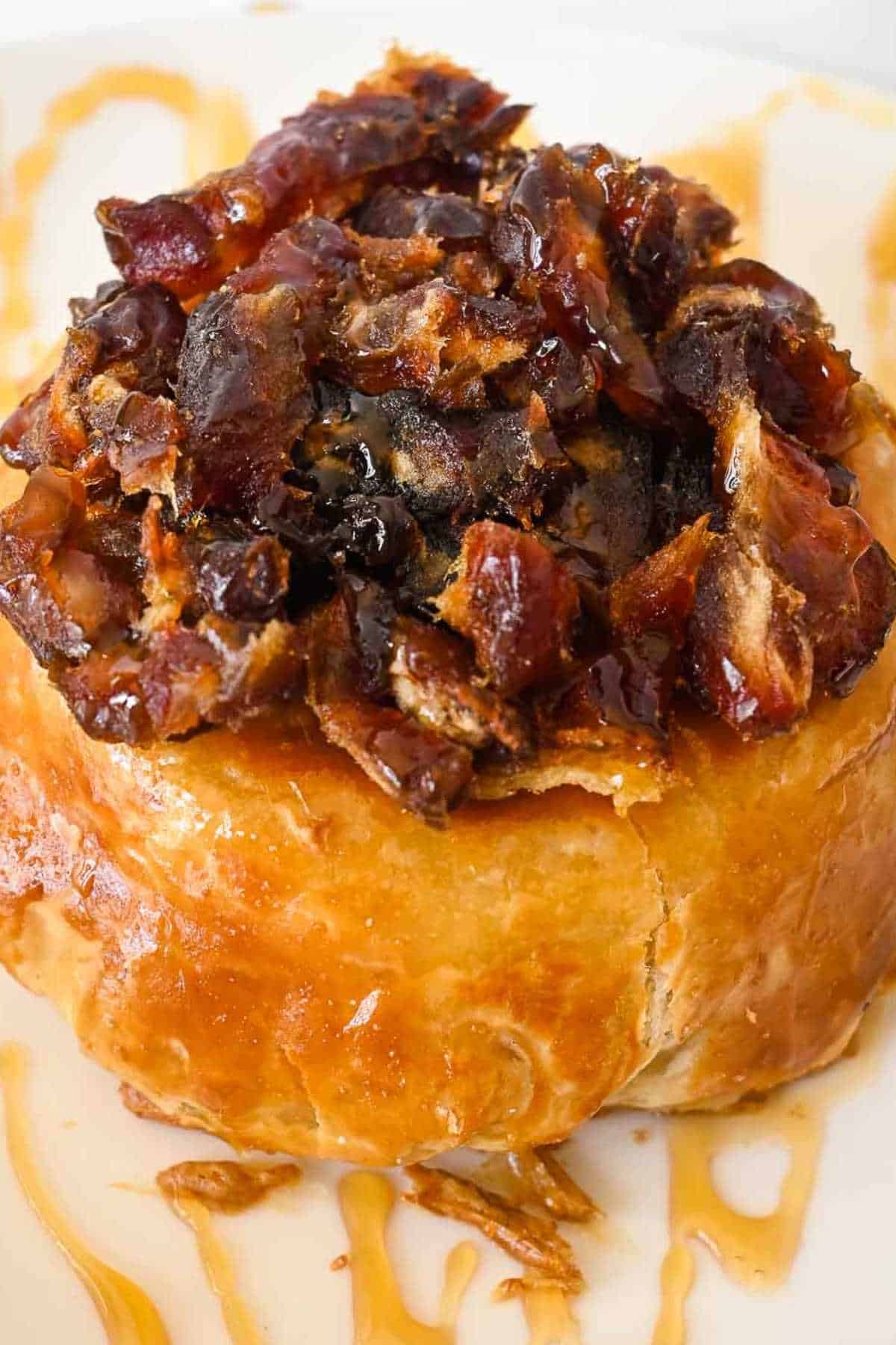 air fryer brie wrapped in puff pastry topped with dates and drizzled honey.