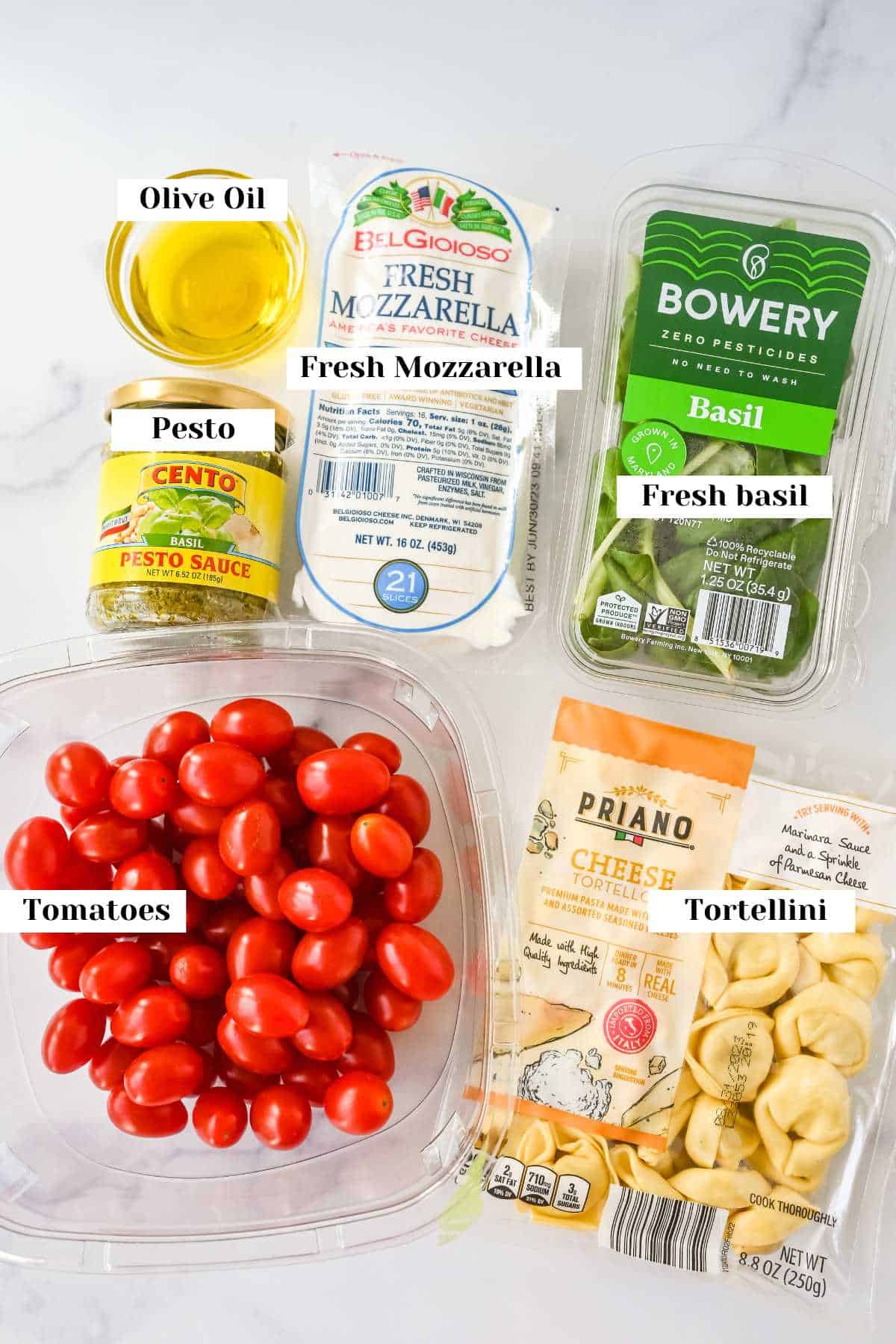 labeled ingredients for pesto tortellini salad.