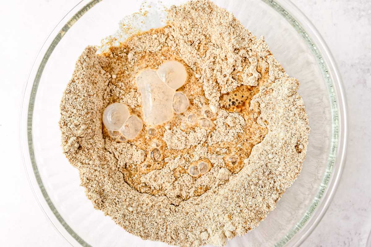 dry ingredients for nectarine cobbler in a glass bowl.