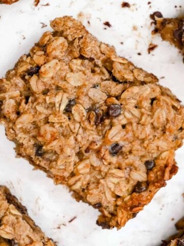 close up of 4-ingredient banana oatmeal bars on a white background.