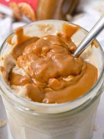 close up shot of overnight oats topped with Biscoff cookie butter.