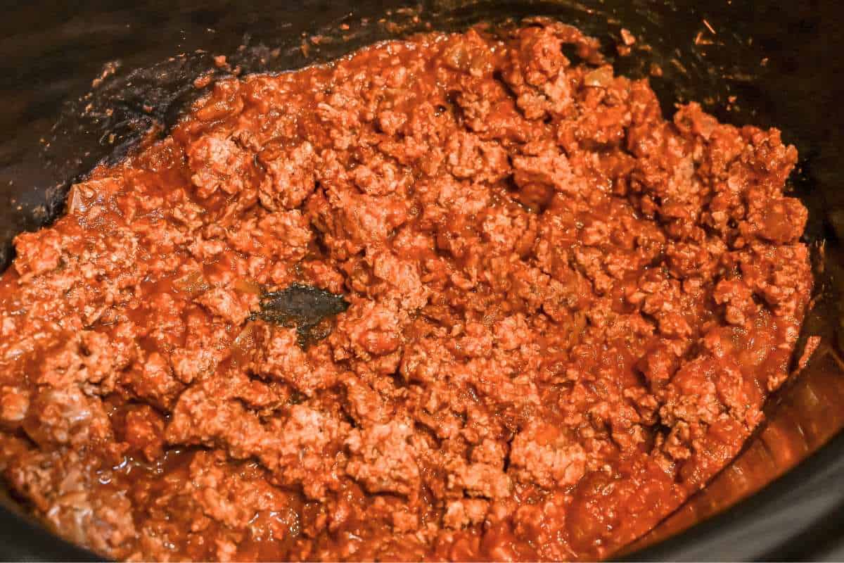 cooked taco meat in a crock pot.