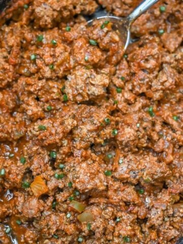 close up of cooked taco meat in a crock pot.