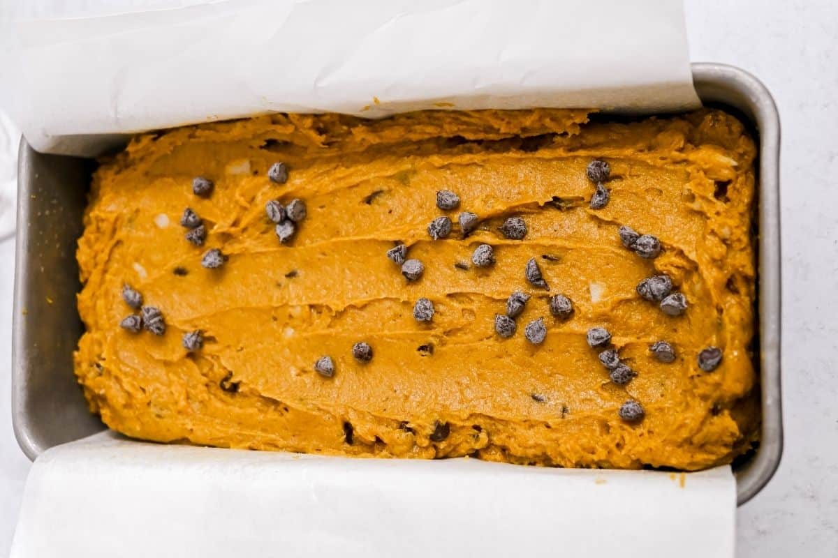 unbaked pumpkin bread in a loaf pan.