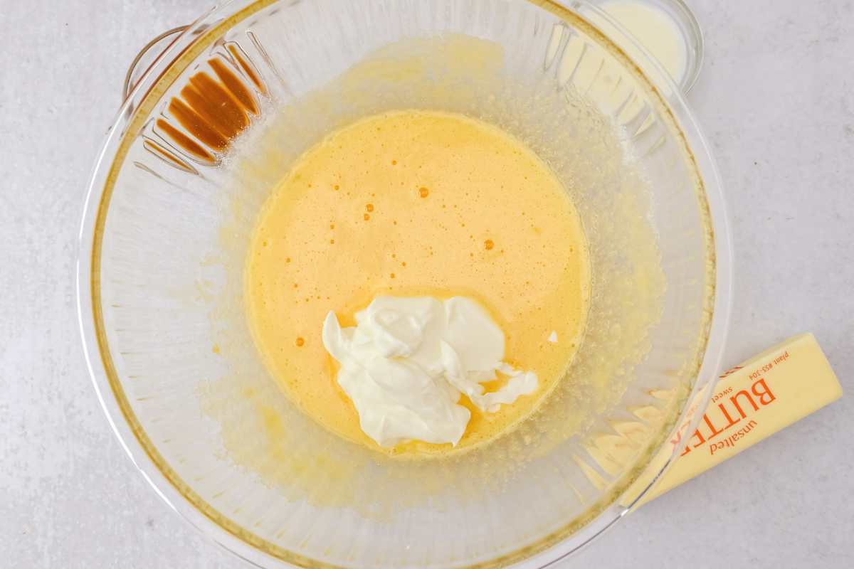 wet ingredients for coffee cake in a glass bowl.