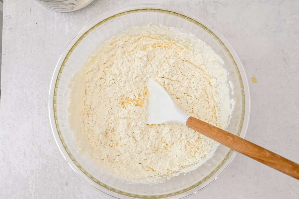 ingredients for coffee cake in a glass bowl with a spatula.