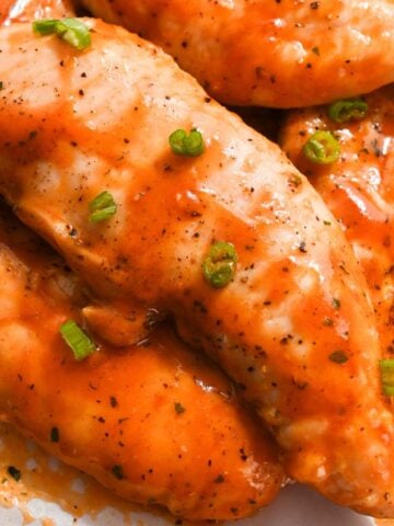 close up of buffalo chicken tenders with no breading.