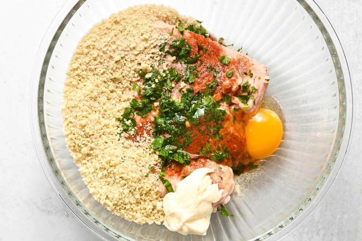 air fryer chicken burger ingredients in a glass bowl