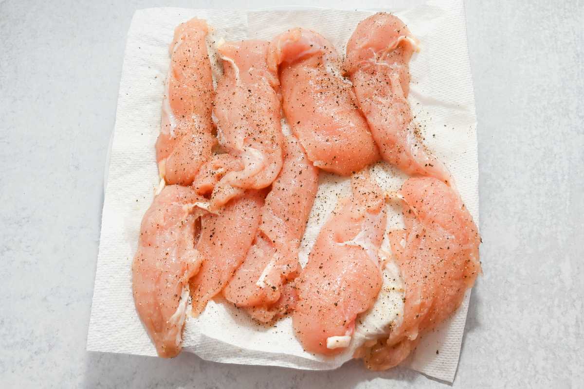 seasoned chicken tenders on a paper towel.