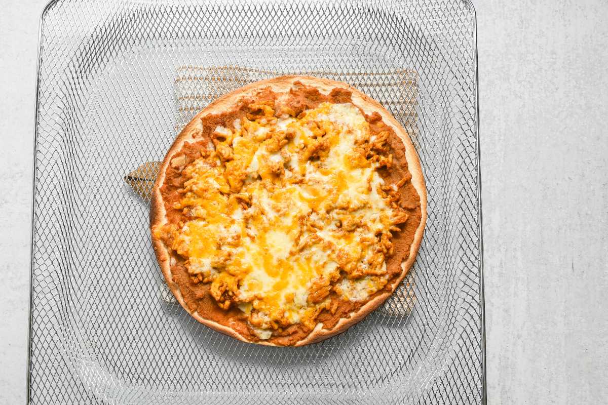 cooked air fryer Mexican pizza on an air fryer tray.