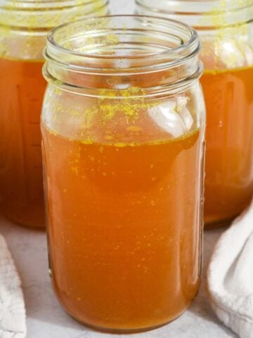 featured image for homemade bone broth in glass jars.