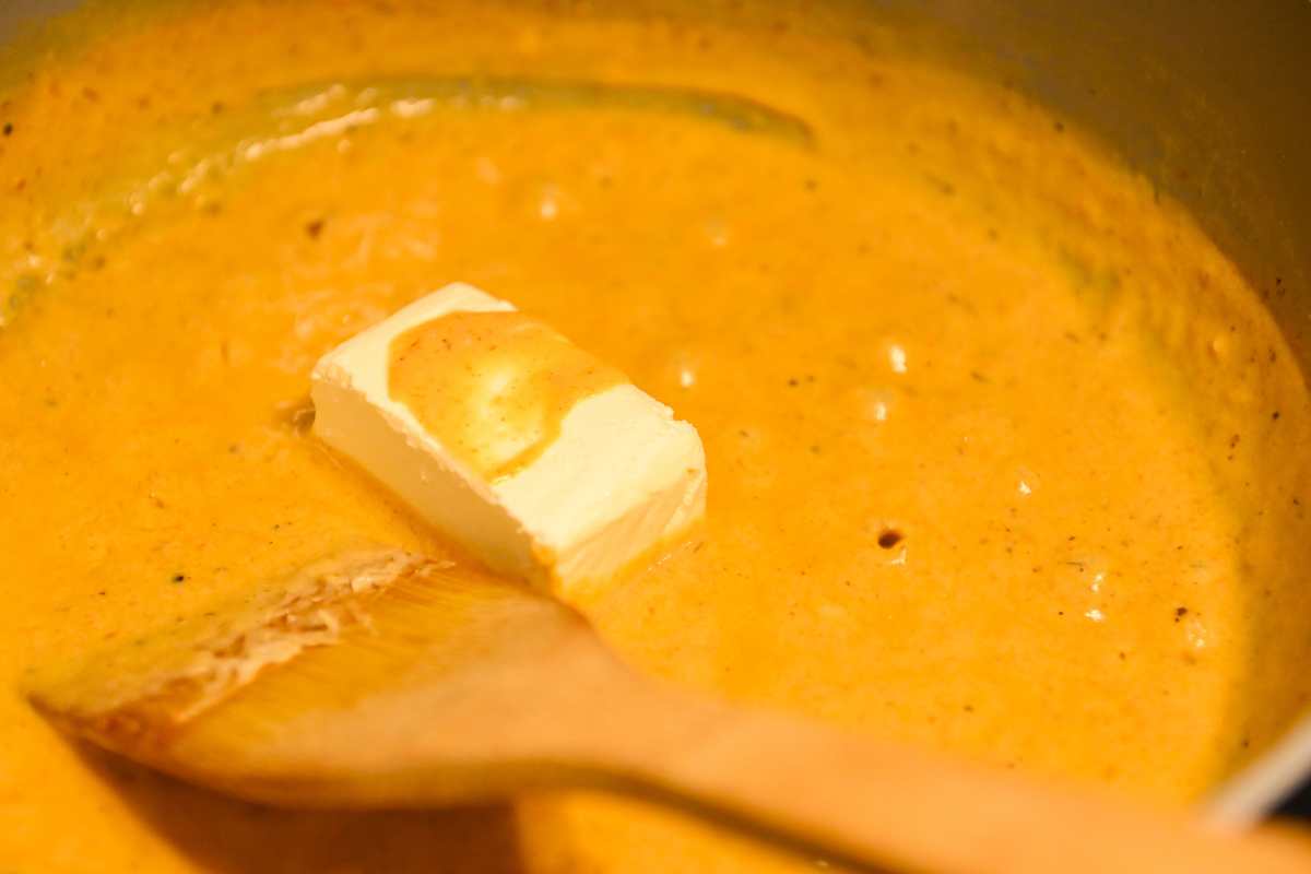 melting cream cheese in cajun cream sauce.