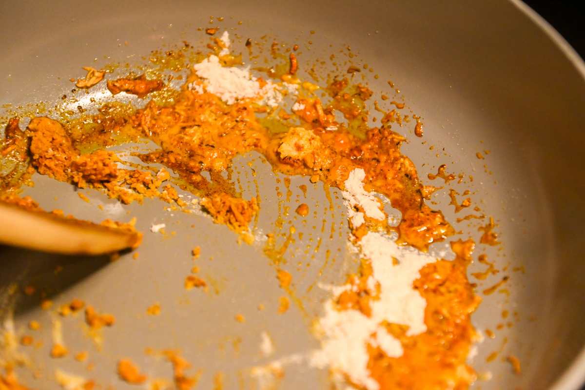 cajun seasoning with garlic and butter in a pan.